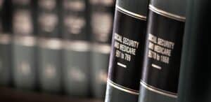 SocialSecurityAndMedicaidBenefitsLegalLawBooksOnShelf